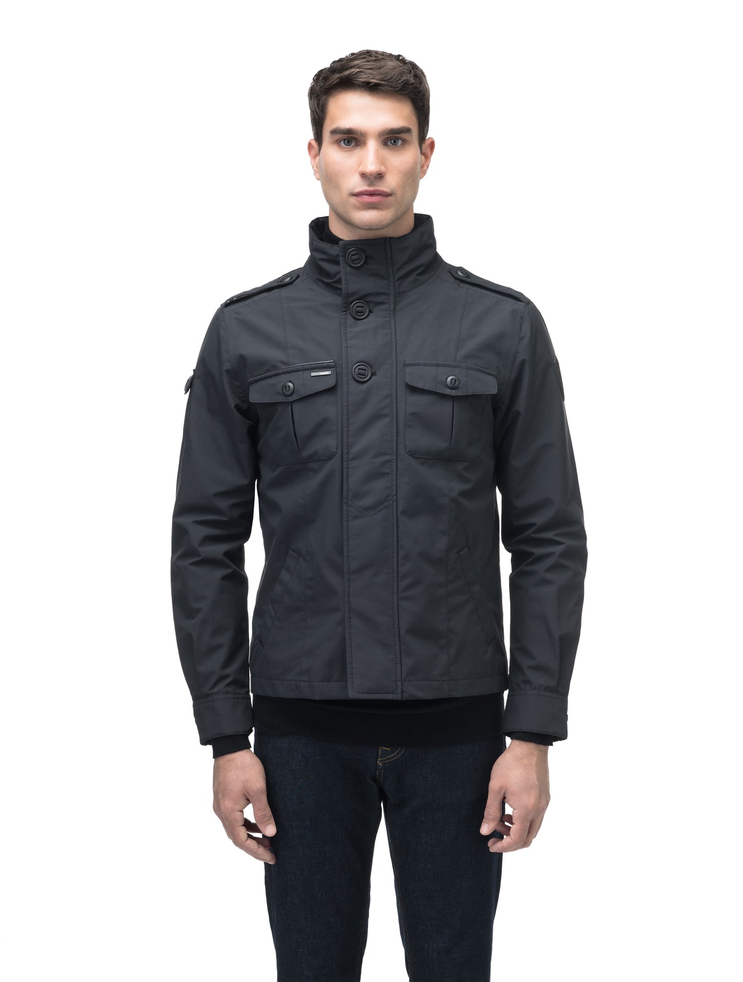 A person is wearing the Admiral Men's Jacket by Nobis, a sleek design with advanced fabric technology, high collar, and front pockets, against a white background.
