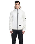 A person wearing the Hedge Men's Performance Hoodie by Nobis, a luxurious zip-up with a hood and black drawstrings made from merino wool for added warmth, paired with dark pants against a plain white background.