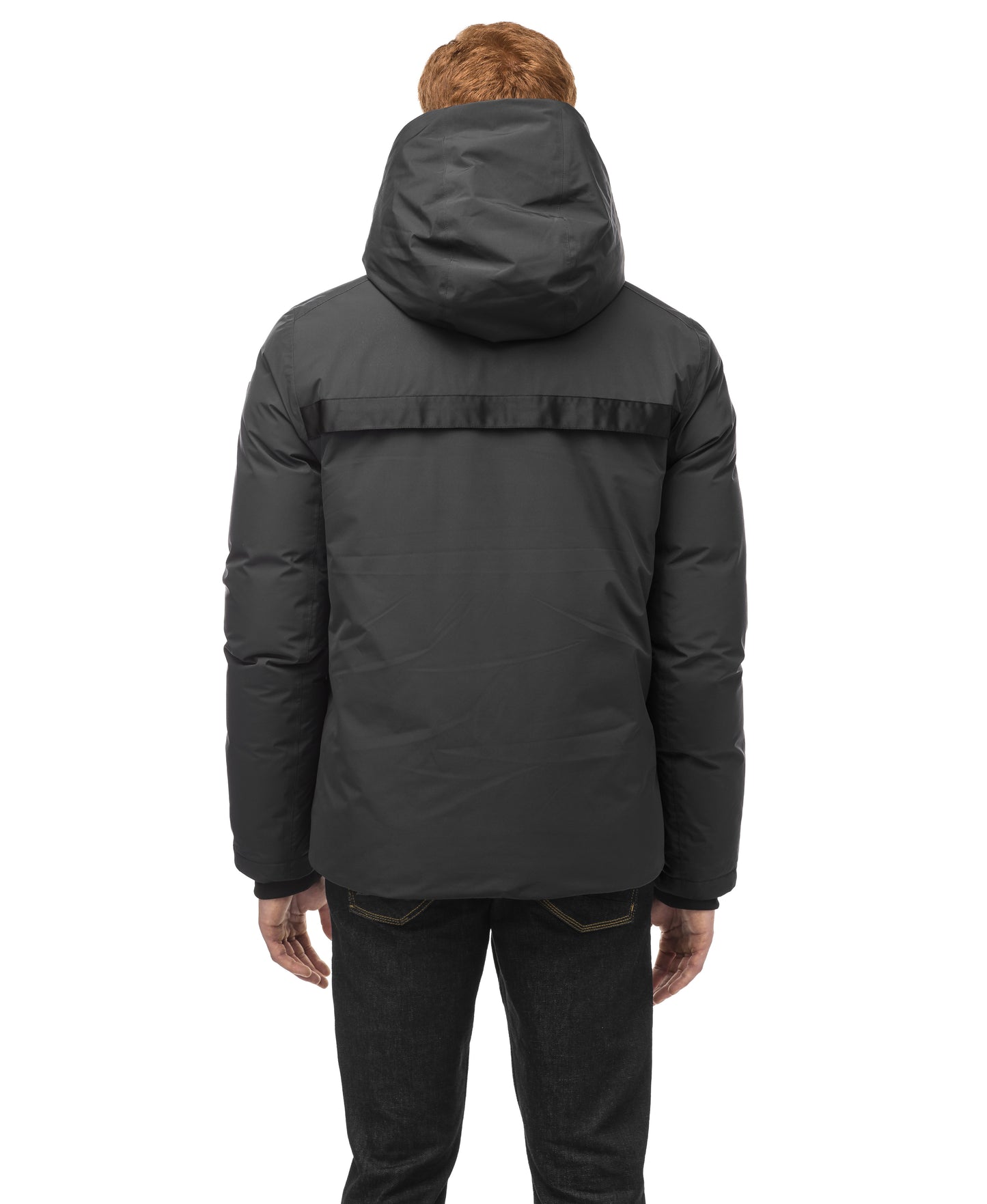 A person stands against a white background wearing a Nobis Oliver Men's Reversible Puffer Jacket, seamlessly transitioning from day to night.