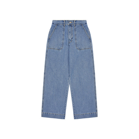 The Kappy One Tuck Wide Fatigue Denim Pants, in unisex blue, feature a high-waisted wide-leg design. Made from cotton with front pockets and a button-zipper closure, these versatile pants come in a one-size-fits-most style and are displayed on a white background.