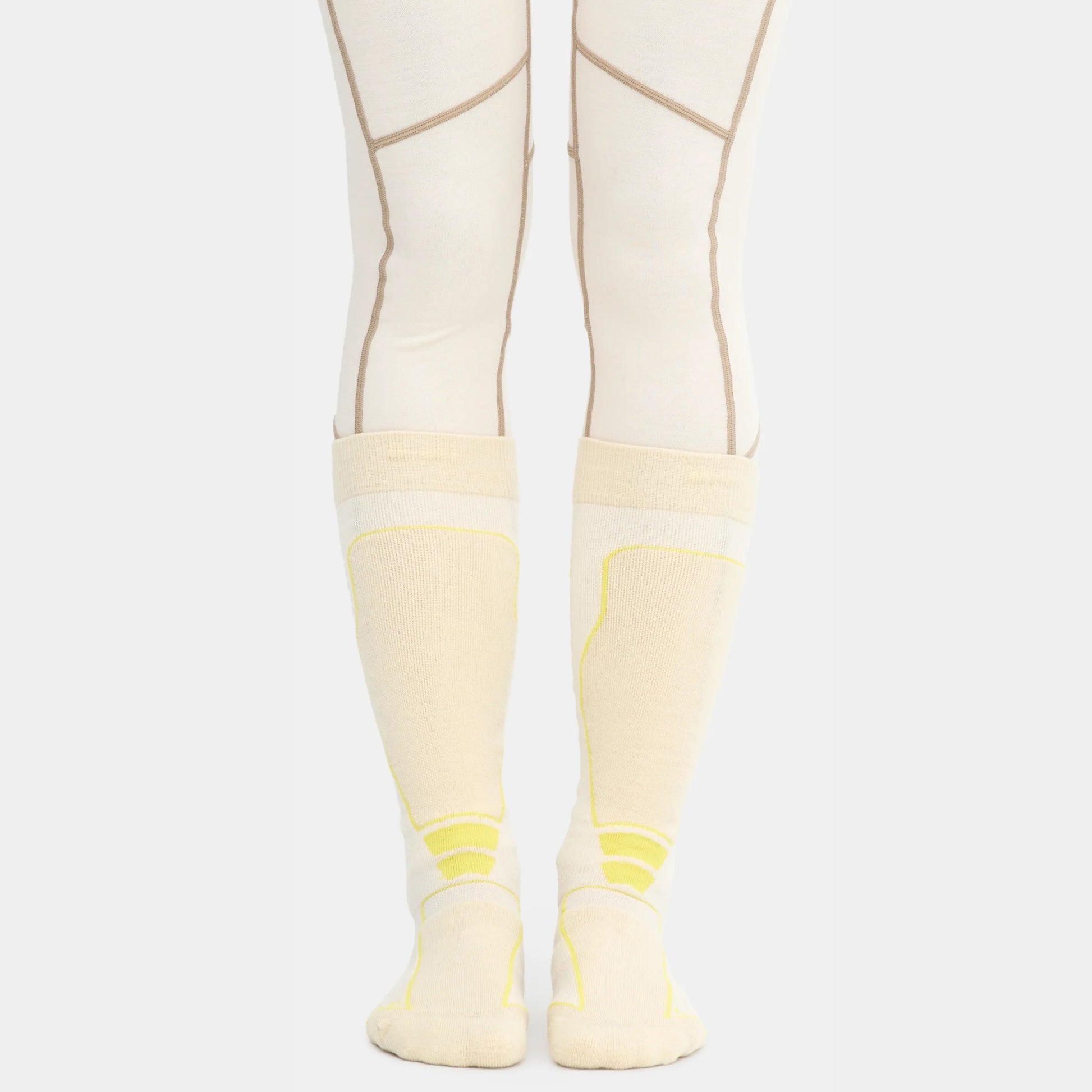 Front view of ski socks in an oat colorway on model