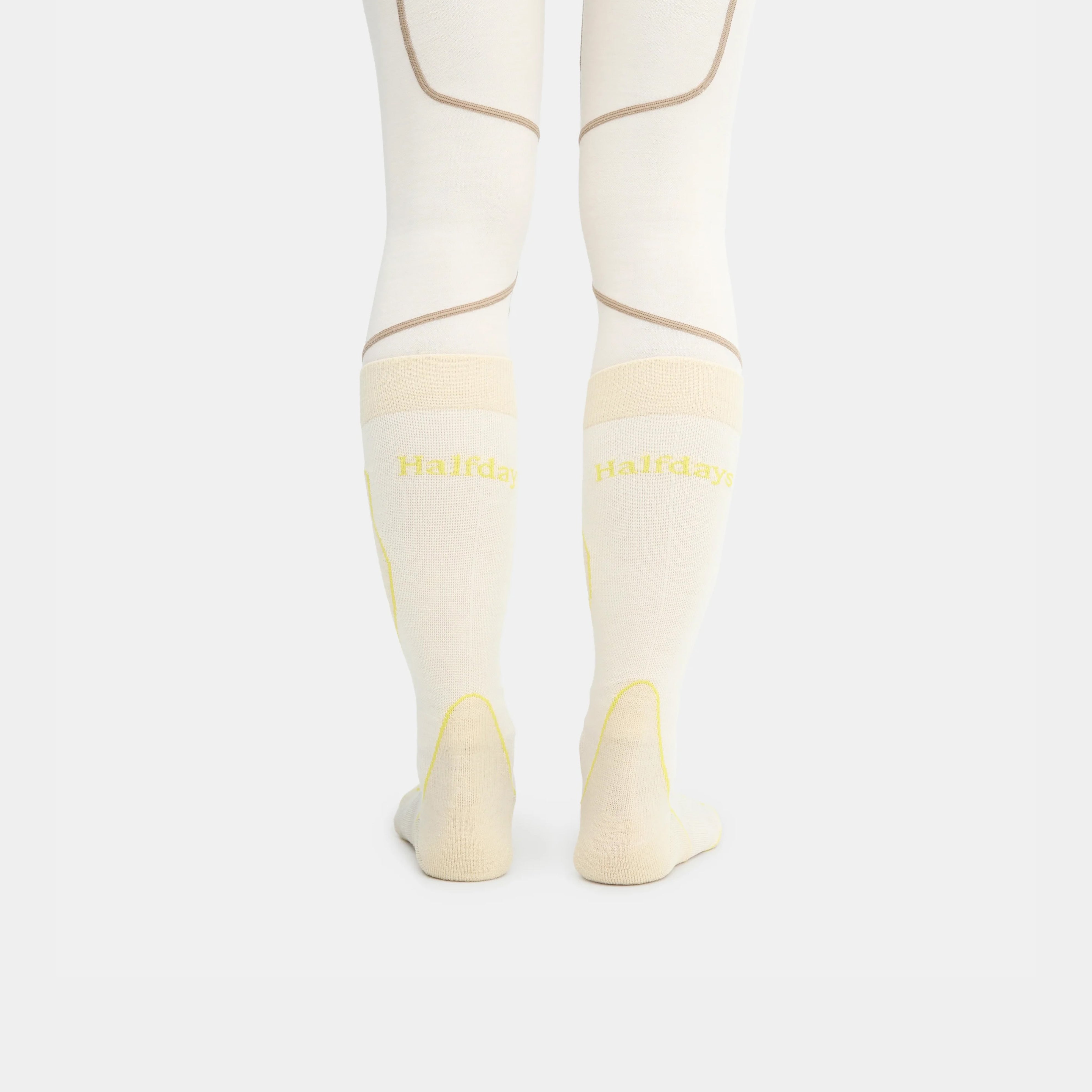 Woman wearing socks with "HALFDAYS" logo on back