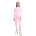 A person flaunting a pink Halfdays Johnson top paired with a matching beanie and white boots, set against a plain white background, exudes the confidence of someone who embraces an active outdoor fit.