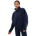 A person wearing the Halfdays Pieper Fleece in navy blue and leggings stands against a white background.