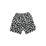 Pleated Track Short in Indigo Flower by Universal Works, showcased against a black backdrop.