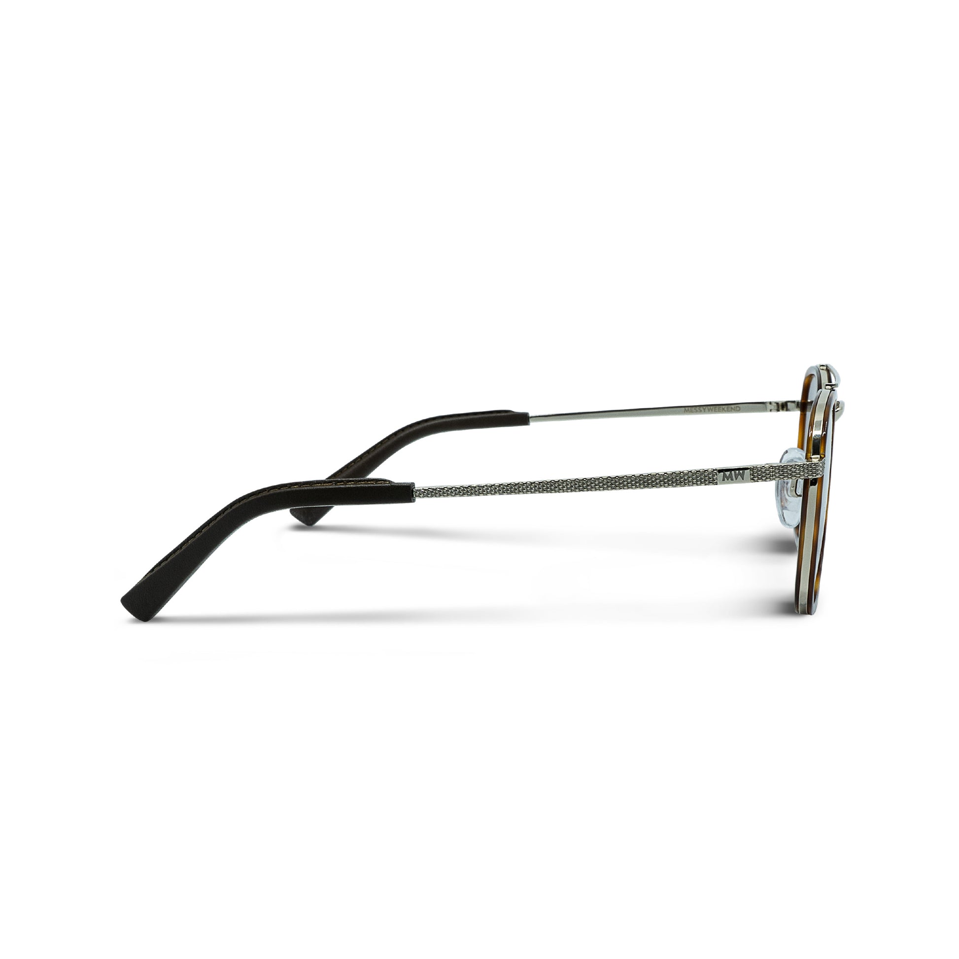 Side view of Messyweekend Quentin eyeglasses in Brown/Gold, featuring a handmade metal frame, tortoiseshell rims, black temple tips, and high-quality lenses against a white background.