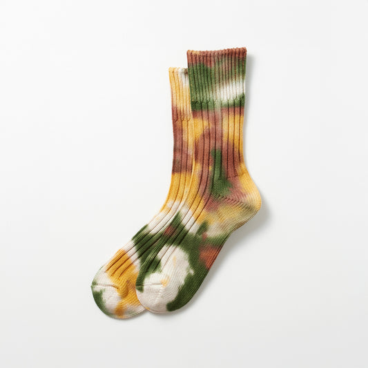 RoToTo's Chunky Ribbed Crew Socks feature a tie-dye pattern in green, gold, and brown on a plain white background.
