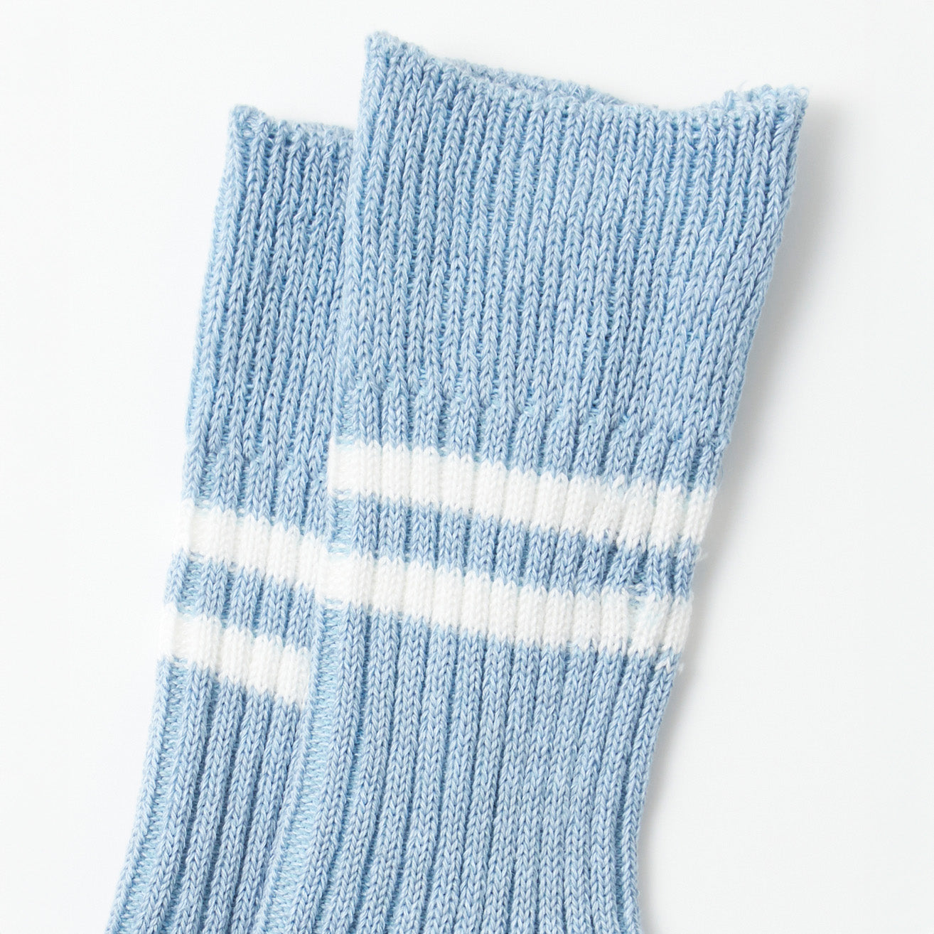 Close-up of RoToTo's Hemp/Organic Cotton Stripe Sock in Morning Blue/White, featuring two white stripes near the cuffs, set against a plain white background.