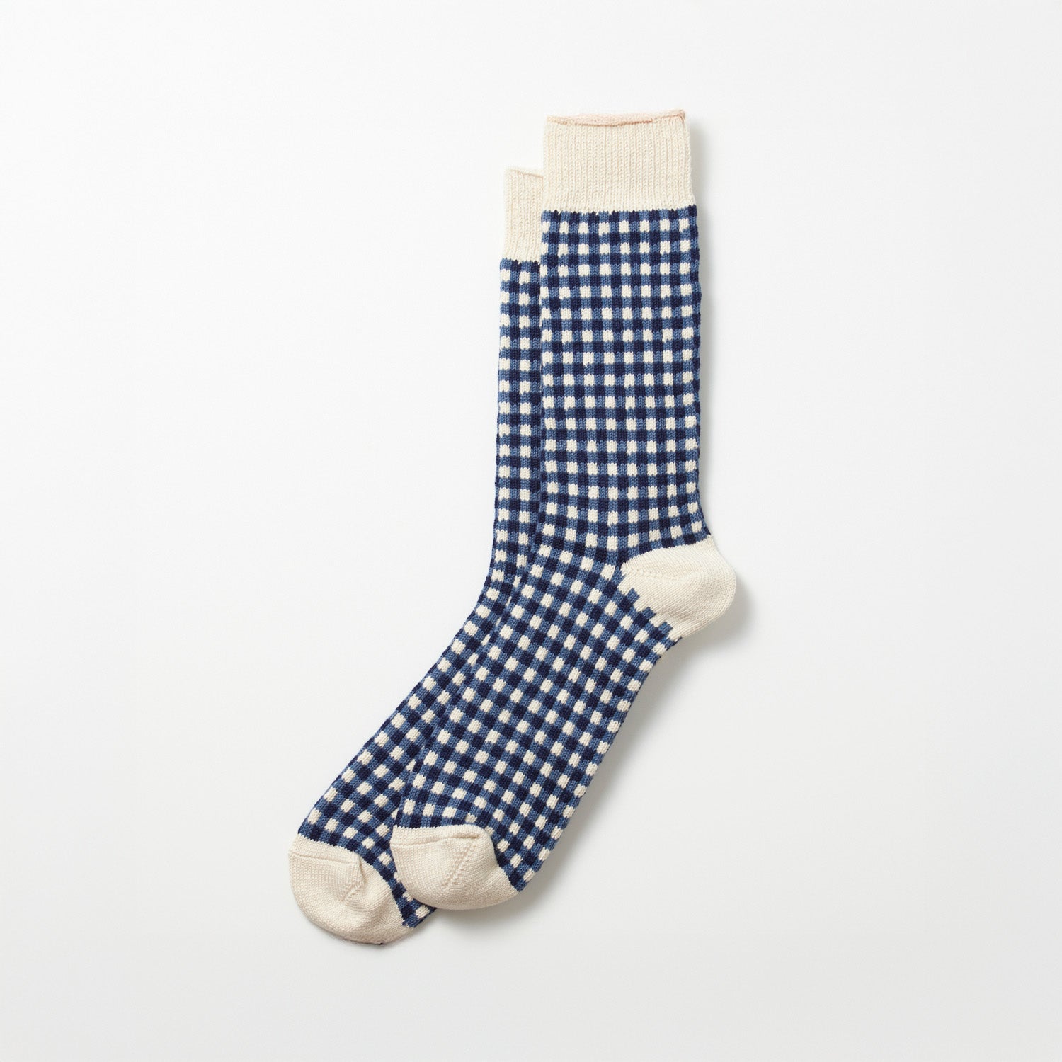 The RoToTo Gingham Check Socks in Navy feature a blue and white checkered pattern with beige accents on the toes, heels, and cuffs, laid flat on a light background.