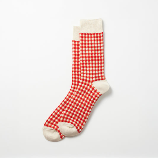 On a plain white background, the Gingham Check Socks, Red by RoToTo display a pattern of red and white checks with cream-colored toes, heels, and cuffs.