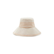 A cream-colored Lola Hats bucket hat with orange and beige Tide Lines stripes on the brim, featuring Rust stitching, isolated on a white background.