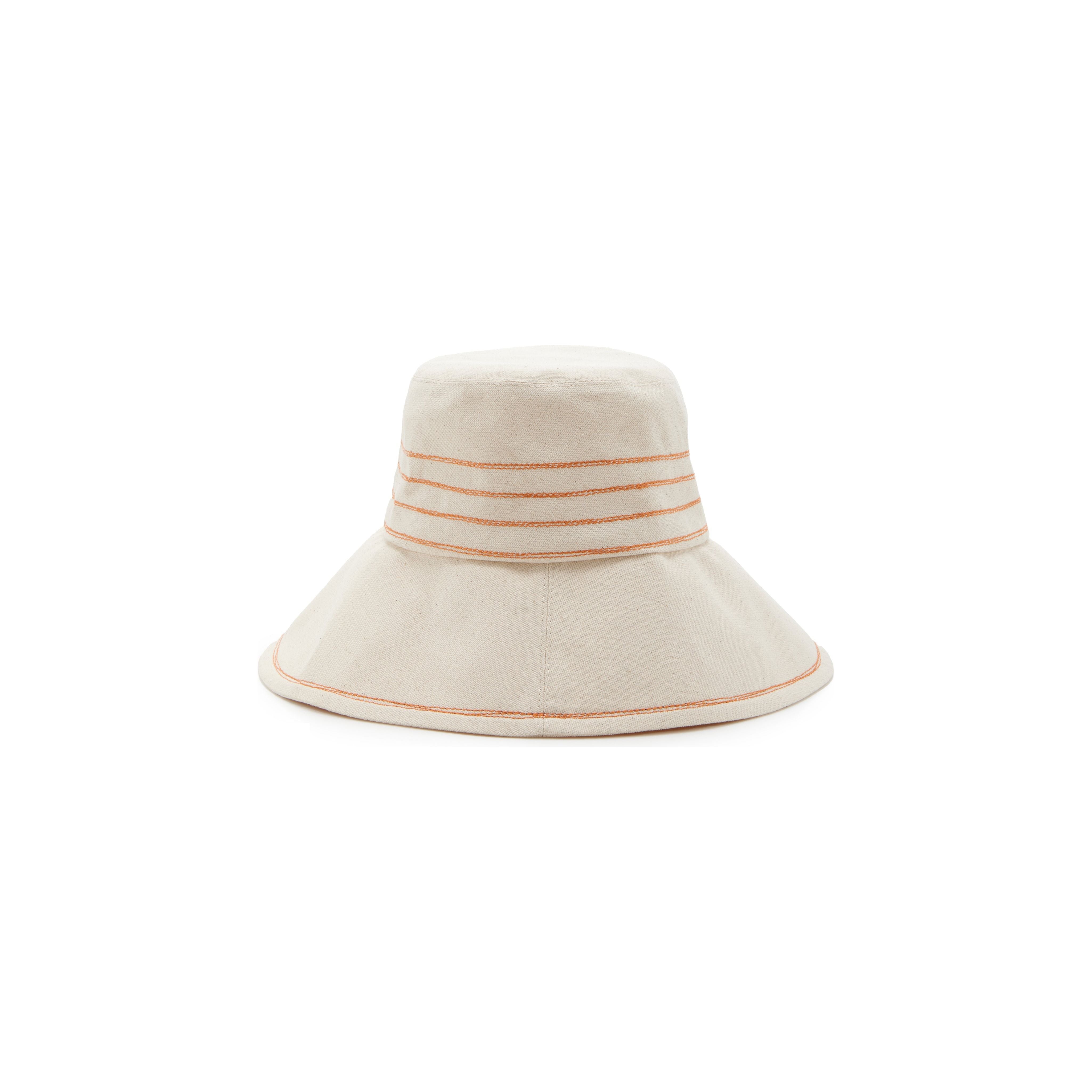 A cream-colored Lola Hats bucket hat with orange and beige Tide Lines stripes on the brim, featuring Rust stitching, isolated on a white background.