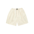 Kappy's Two Tuck Wide Half Pants in light beige feature front pleats, side pockets, and a black buckle belt, shown on a white background.