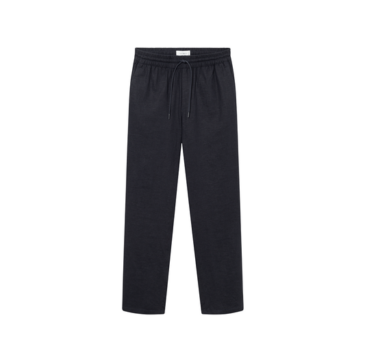 The Patrick Linen Pants by Les Deux are dark navy drawstring lounge pants made from breathable linen viscose with a relaxed fit, shown on a white background.