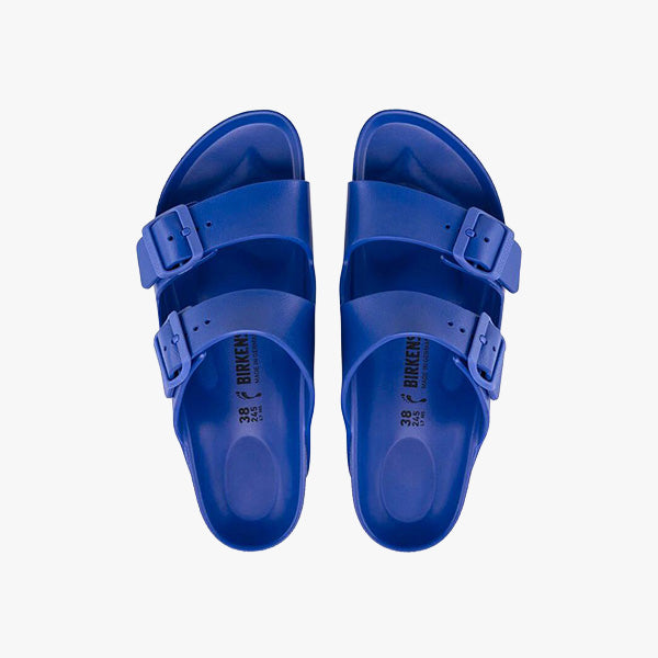 The Birkenstock Arizona EVA Regular in Ultra Blue is a unisex pair of waterproof slip-on sandals with two adjustable buckle straps, shown from above against a white background.