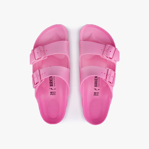 A pair of Birkenstock Arizona EVA Narrow sandals in Candy Pink, featuring two adjustable straps, shown from above on a white background.