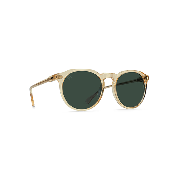 The Raen Optics Remmy 49 sunglasses in Champagne Crystal feature round clear frames and green polarized lenses, shown on a white background.