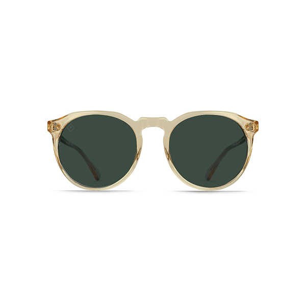 The Raen Optics Remmy 49 sunglasses feature round clear Champagne Crystal frames with green polarized lenses, crafted from polished zyle acetate and shown against a white background.