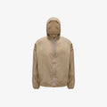 The K-Way Le Vrai 3.0 Claude in Beige Taupe is a windproof ripstop packable jacket with a front zip featuring a multicolored stripe, elastic cuffs, and a small left chest logo for comfort and durability.