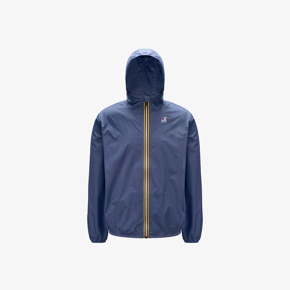 The K-Way Le Vrai 3.0 Claude in Blue Indigo is a unisex jacket with a front zipper, yellow and red stripes, elastic cuffs, a small chest logo, plus a packable and water-repellent design.