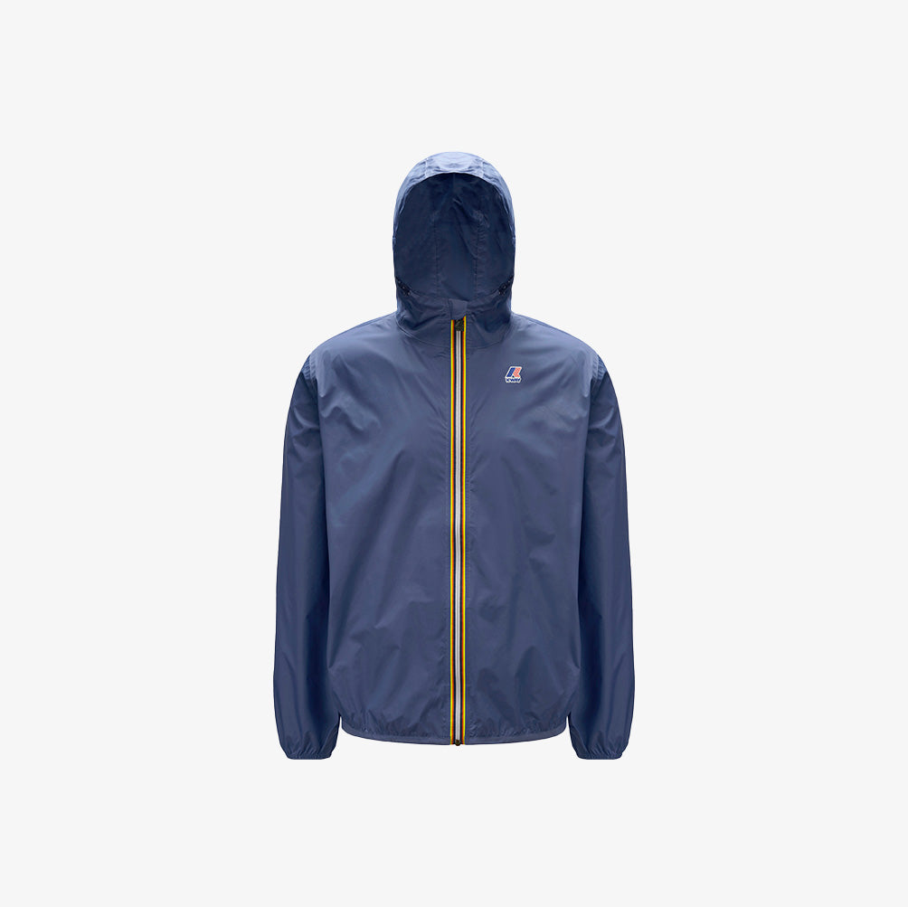 The K-Way Le Vrai 3.0 Claude in Blue Indigo is a unisex jacket with a front zipper, yellow and red stripes, elastic cuffs, a small chest logo, plus a packable and water-repellent design.