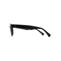 Side view of Raen Optics' Myles sunglasses with a vintage silhouette, crystal black frame, and polarized green lenses against a white background.