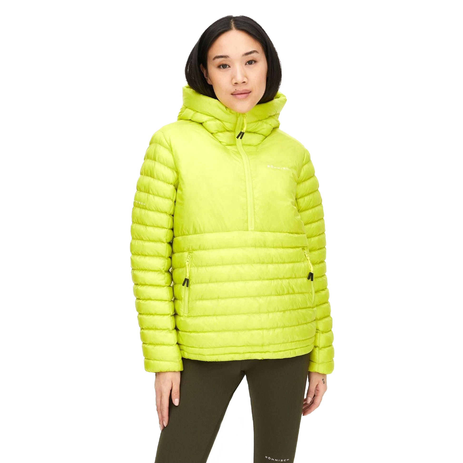 A person dons a Rohnisch Amaze Half Zip insulated puffer jacket in bright green, made from recycled polyester, paired with olive green pants against a plain backdrop.