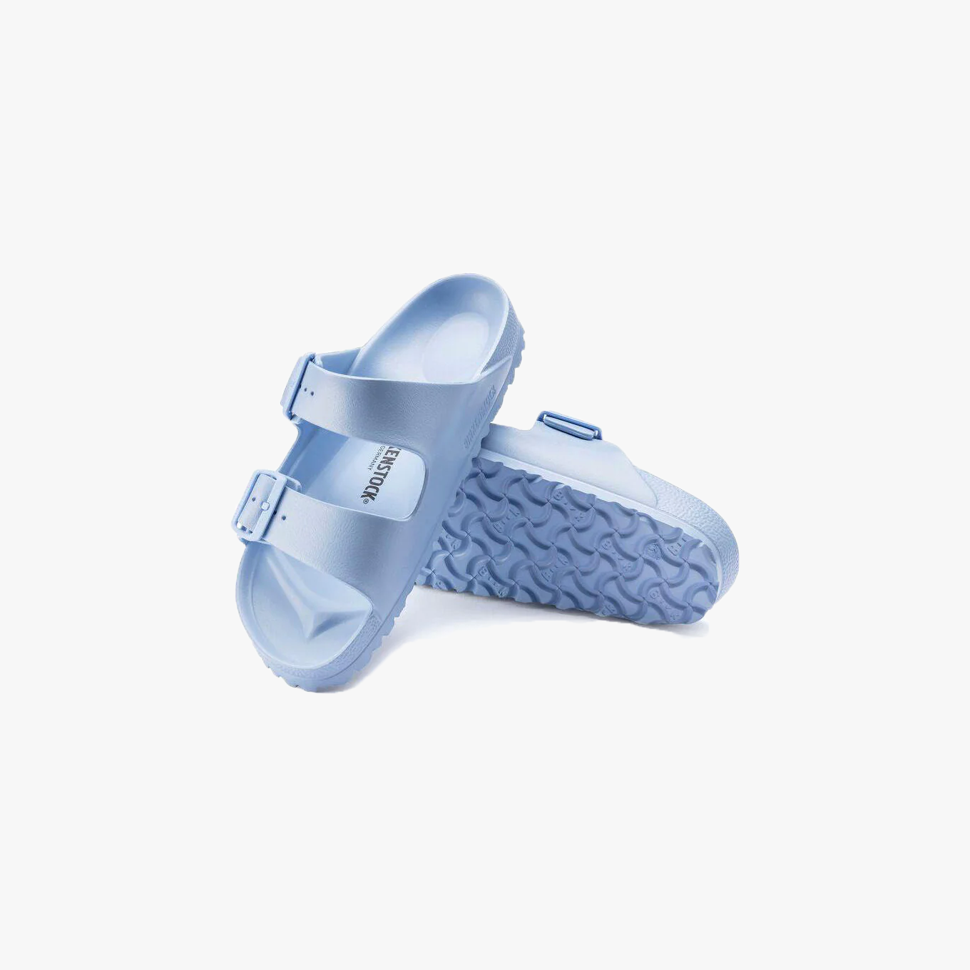 A pair of Birkenstock Arizona EVA Narrow sandals in Dusty Blue with two adjustable straps and a textured sole, shown against a white background.