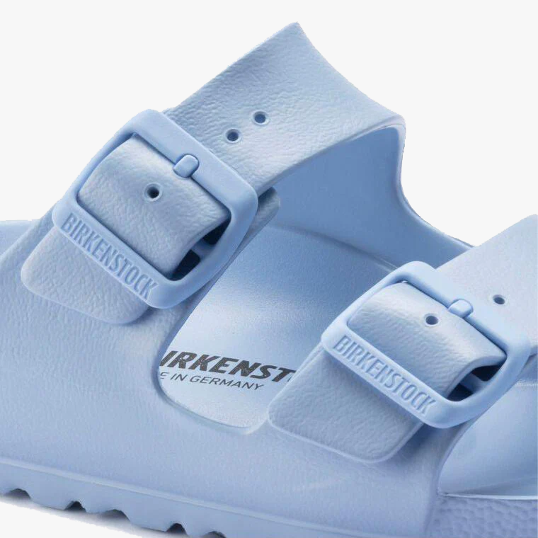 Close-up of the Birkenstock Arizona EVA Narrow sandal in Dusty Blue, a water-friendly style featuring two adjustable straps with embossed brand name on each buckle.