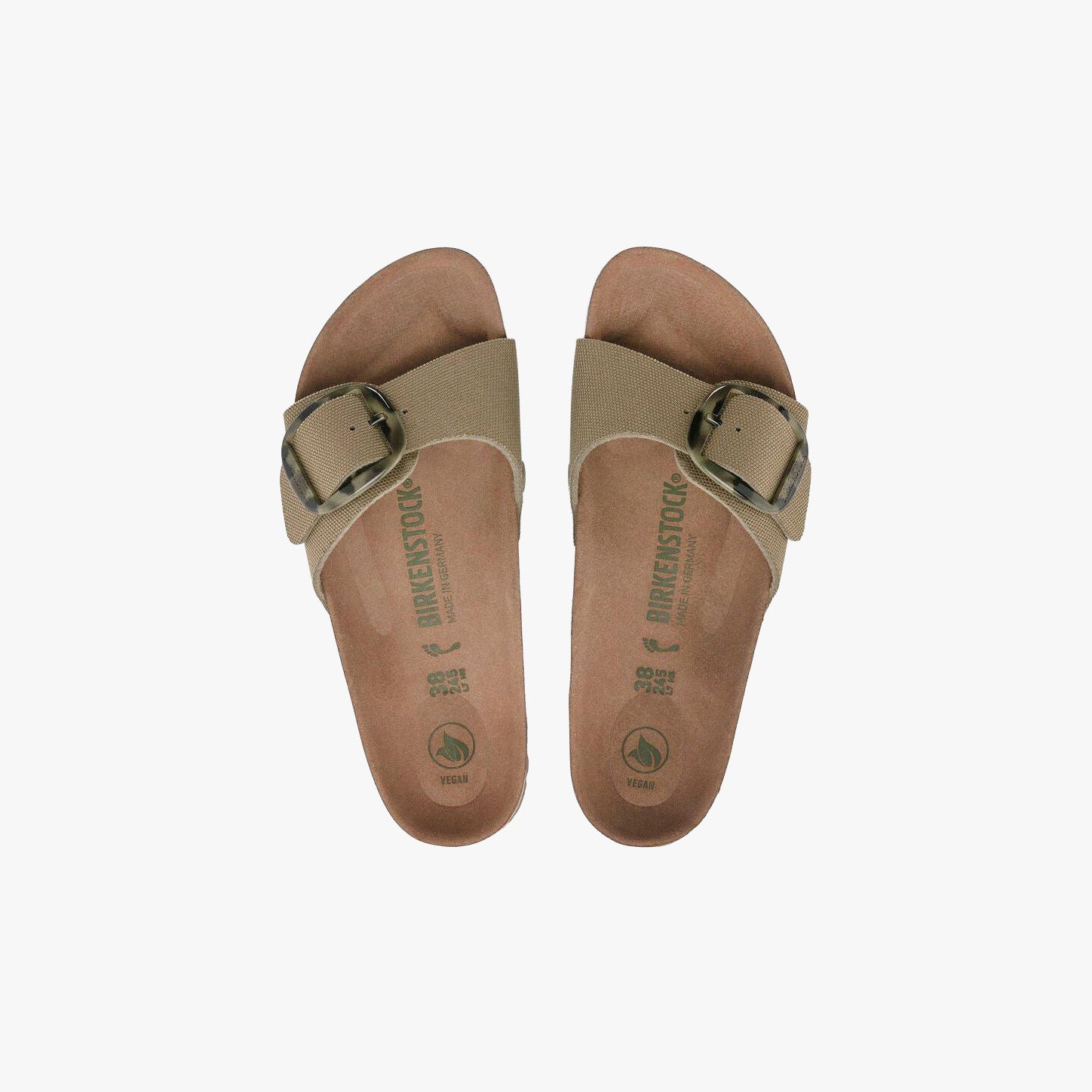 The Birkenstock Madrid Big Buckle Vegan sandals in faded khaki feature a wide adjustable strap with a metal buckle and a supportive cork-latex footbed, shown from above on a plain white background.