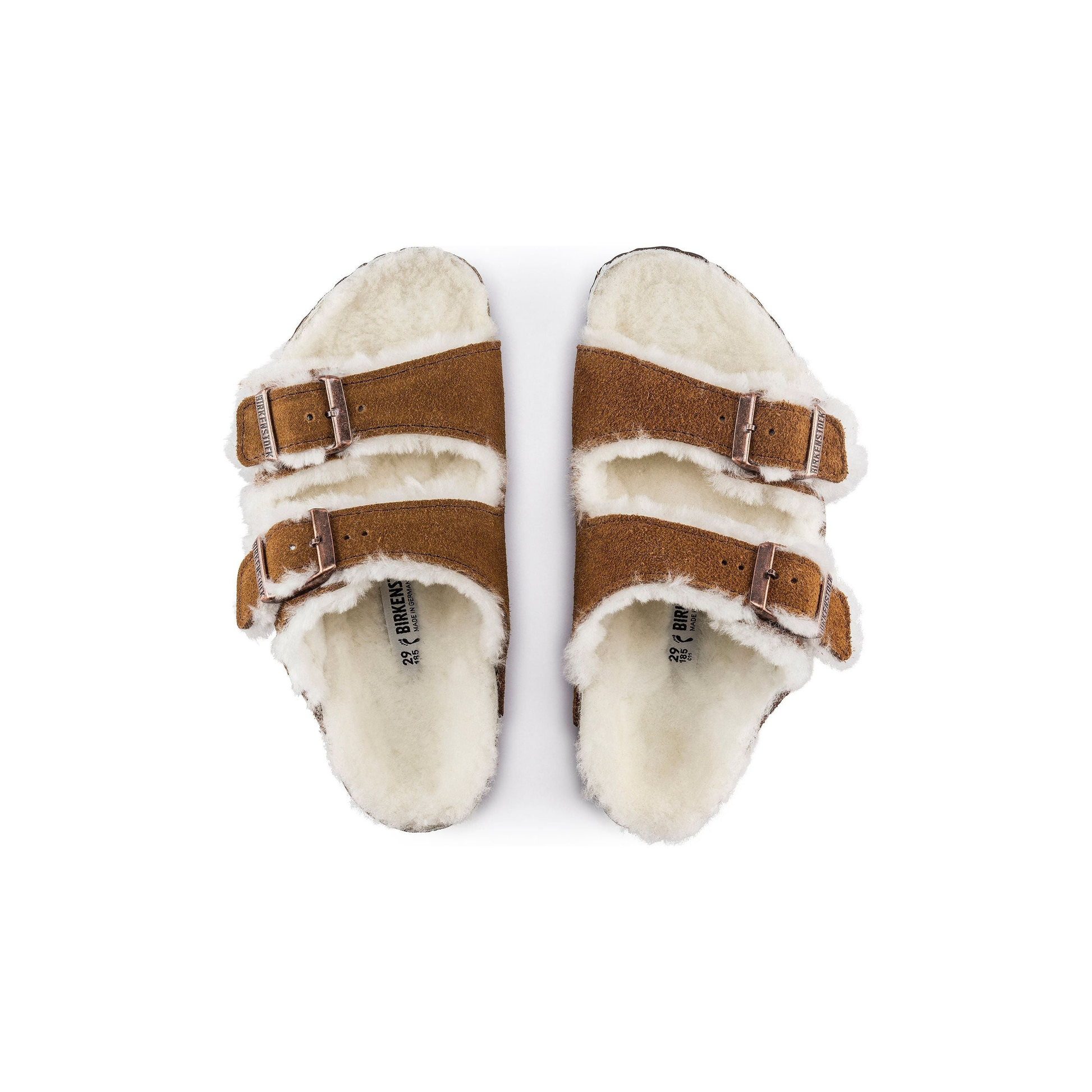 Viewed from above, the Birkenstock W Arizona Shearling/Suede sandals in Mink have a brown hue with a white fluffy lining and double adjustable straps.