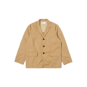 The Capitol Jacket by Universal Works is a tan blazer featuring a notched lapel, three black buttons, and two front pockets, made from recycled polyester. Displayed against a white background.