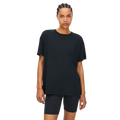 A person in a black Clara Base Tee and loose-fitting shorts stands against a transparent background, highlighting Rohnisch's latest blend of recycled polyester and elastane for ultimate comfort.