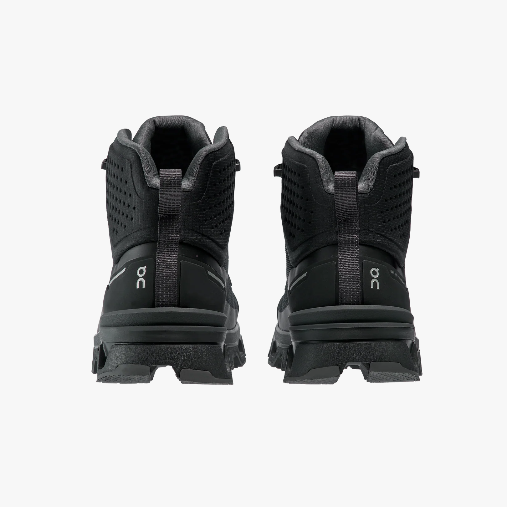 The On Running Men's Cloudrock 2 Waterproof trail shoes, in black, engineered for superior grip, are shown from the back on a plain white background.
