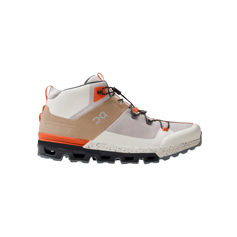 The Men's Cloudtrax by On Running is a high-top athletic shoe featuring gray, white, orange, and brown panels with a robust sole and mesh design, perfect for off-road adventures.