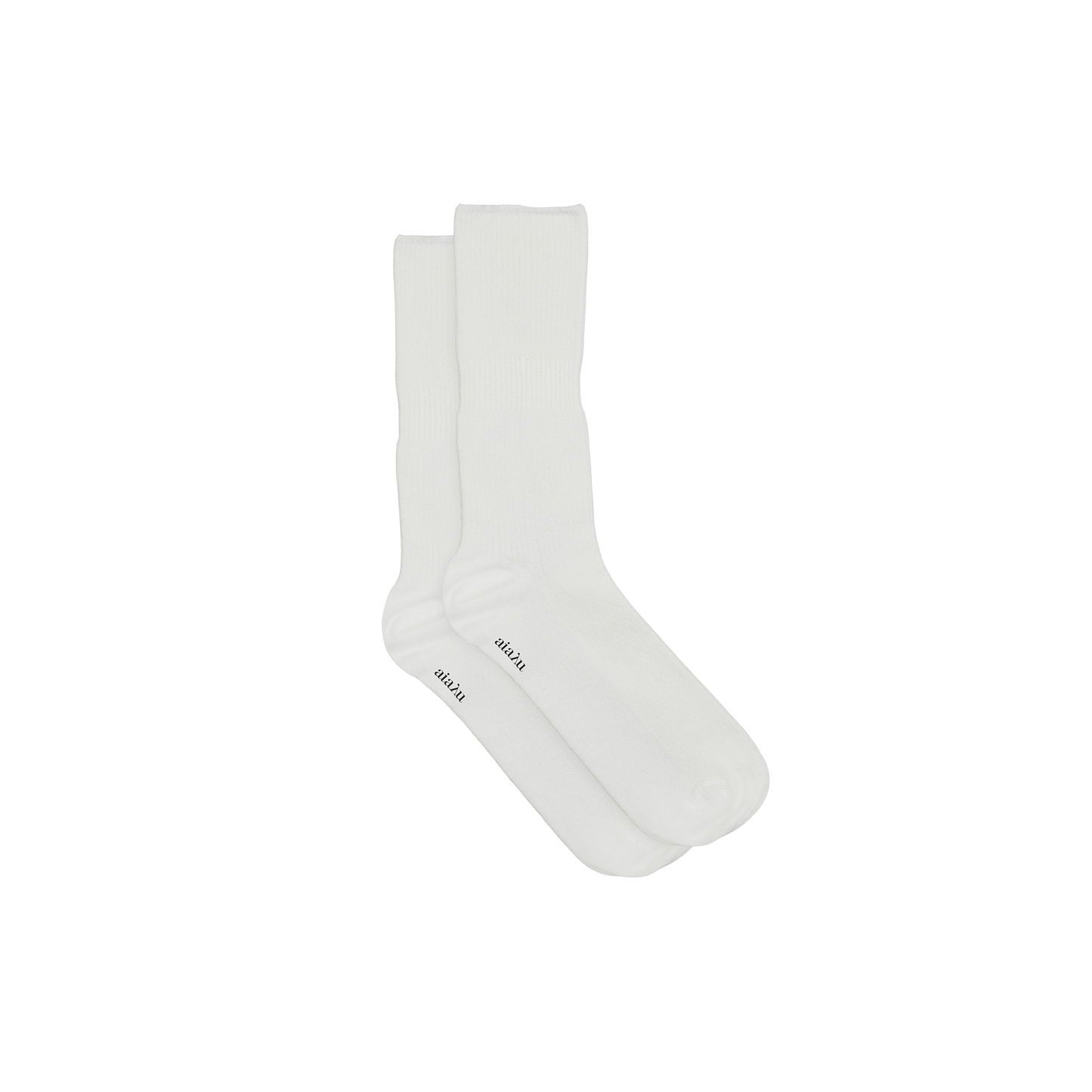 A pair of Aiayu Cotton Rib Socks, plain white and made from organic cotton, features the word "crew" near the toes against a black background.