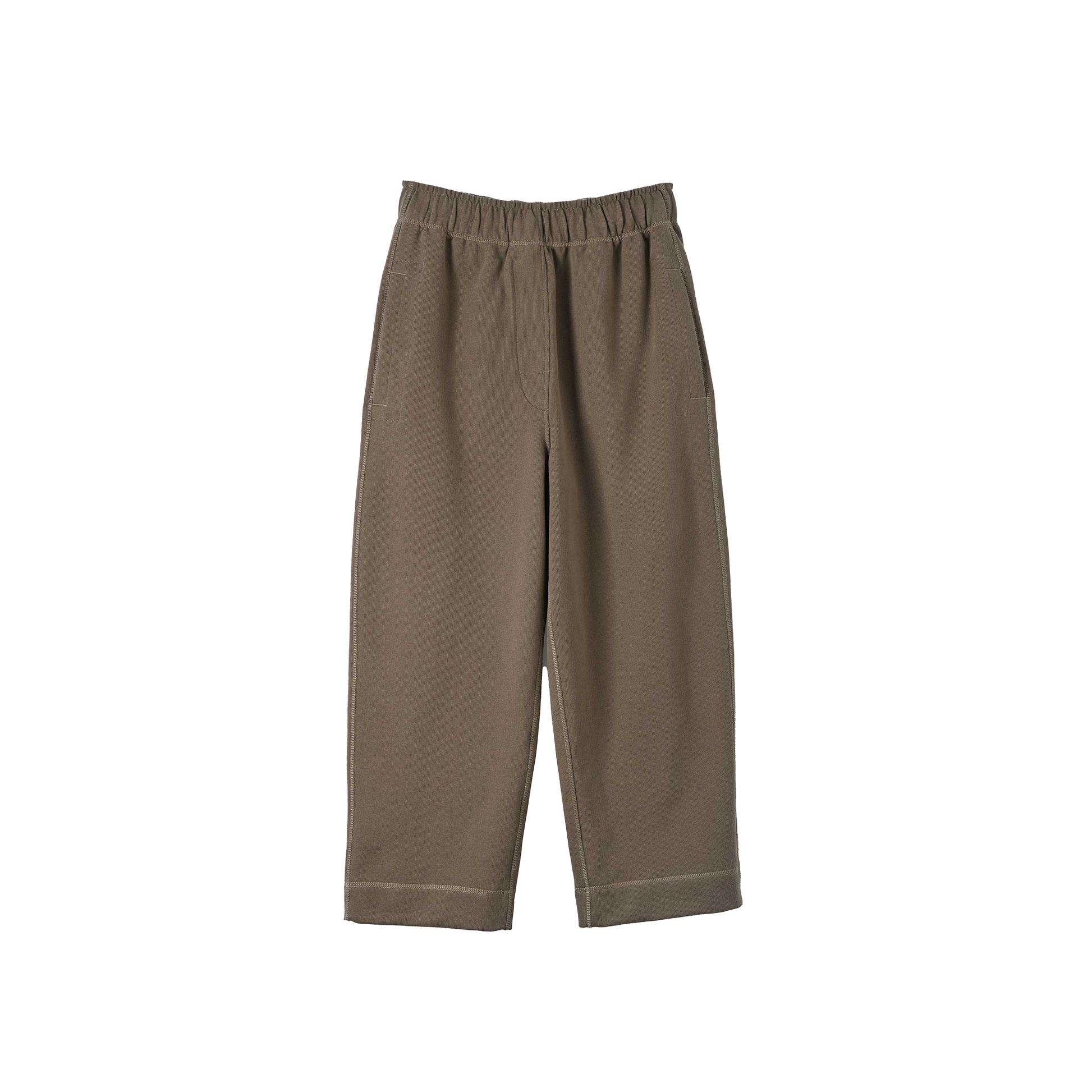 Cropped Track Pant by Margaret Howell, crafted from organic cotton in a brown hue, featuring a wide-leg design with an elastic waistband and two pockets, displayed on a white background.