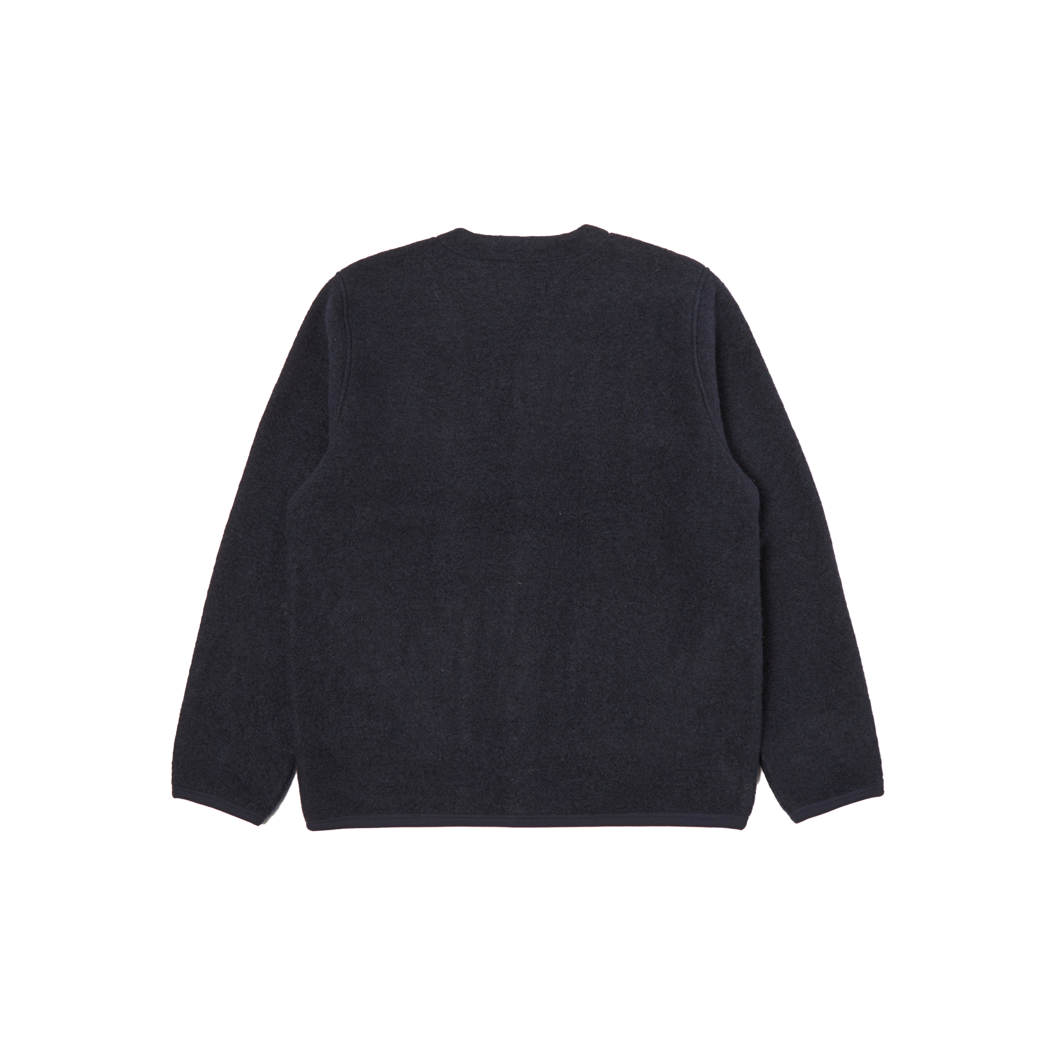 A view from the back showcases the navy blue wool blend Fleece Cardigan by Universal Works.