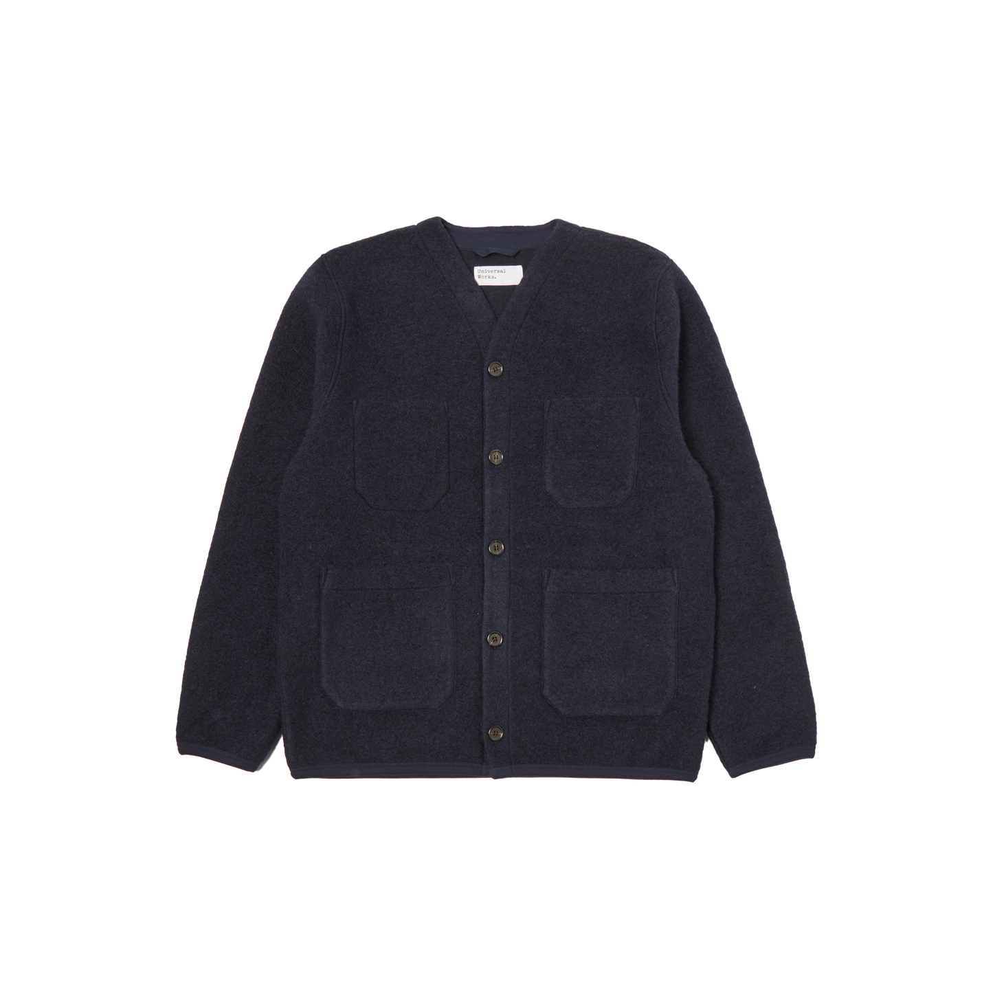 Navy blue Fleece Cardigan by Universal Works in a wool blend, featuring four patch pockets and button-up design, displayed on a white background.