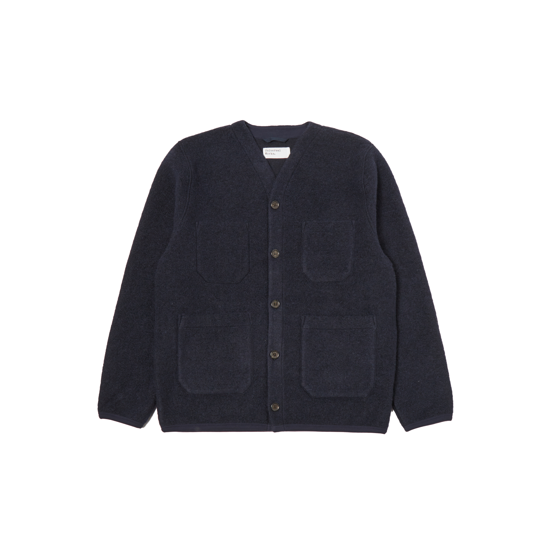 Navy blue Fleece Cardigan by Universal Works in a wool blend, featuring four patch pockets and button-up design, displayed on a white background.