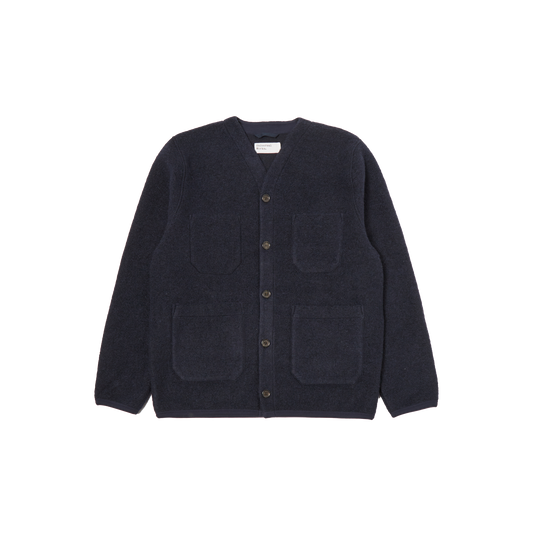 Navy blue Fleece Cardigan by Universal Works in a wool blend, featuring four patch pockets and button-up design, displayed on a white background.