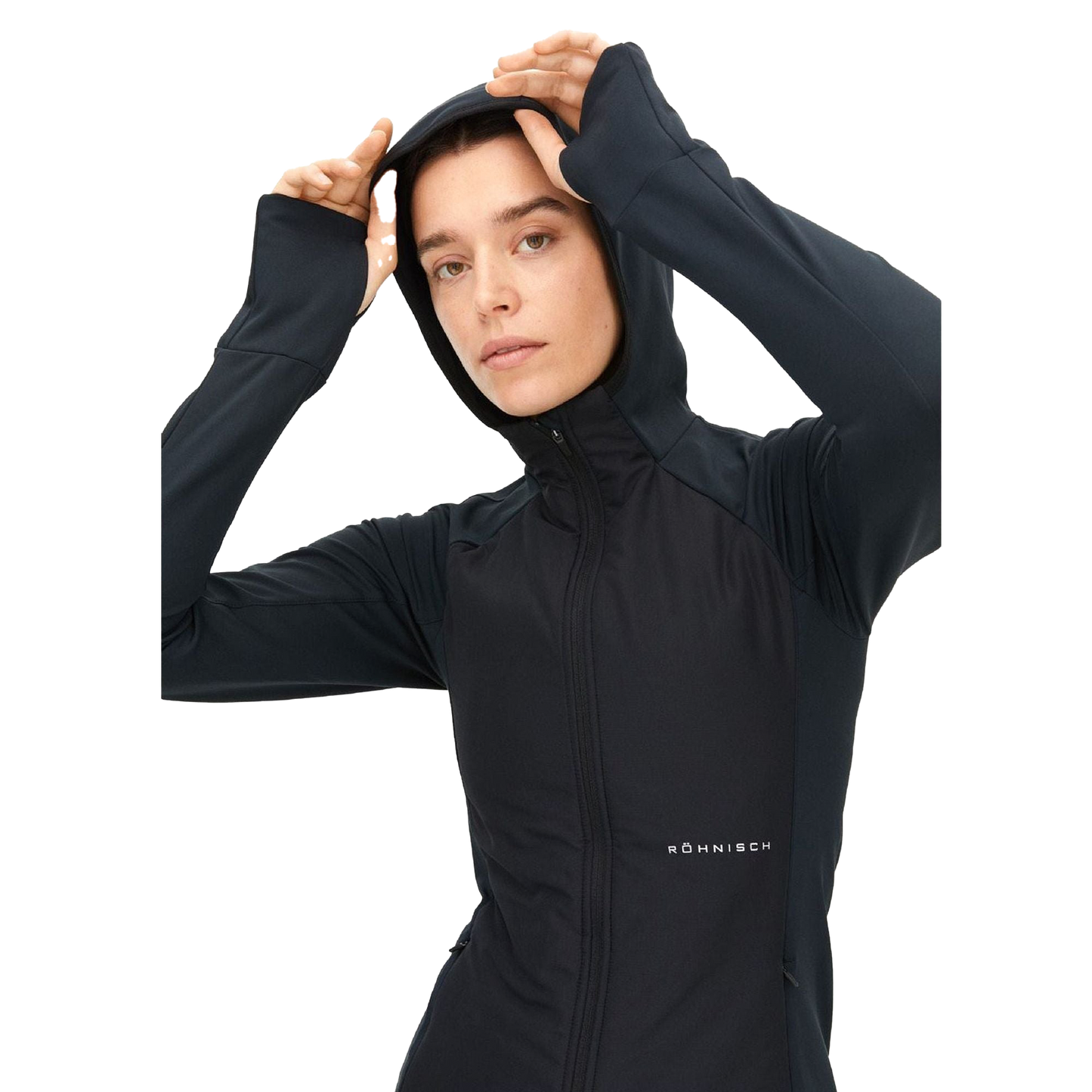 A person wearing the Free Motion Padded Jacket, a black zip-up athletic jacket with a hood from Rohnisch, crafted from recycled Thermo jersey, adjusts it while looking forward.