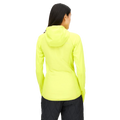A person wearing the Free Motion Padded Jacket by Rohnisch, which is a bright yellow hooded jacket made of quilted woven polyester, along with dark pants, facing away.
