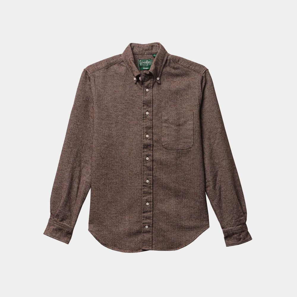 The Gitman Vintage Brown Herringbone Flannel is a brown, long-sleeve button-up shirt with a front chest pocket, displayed flat on a white background.