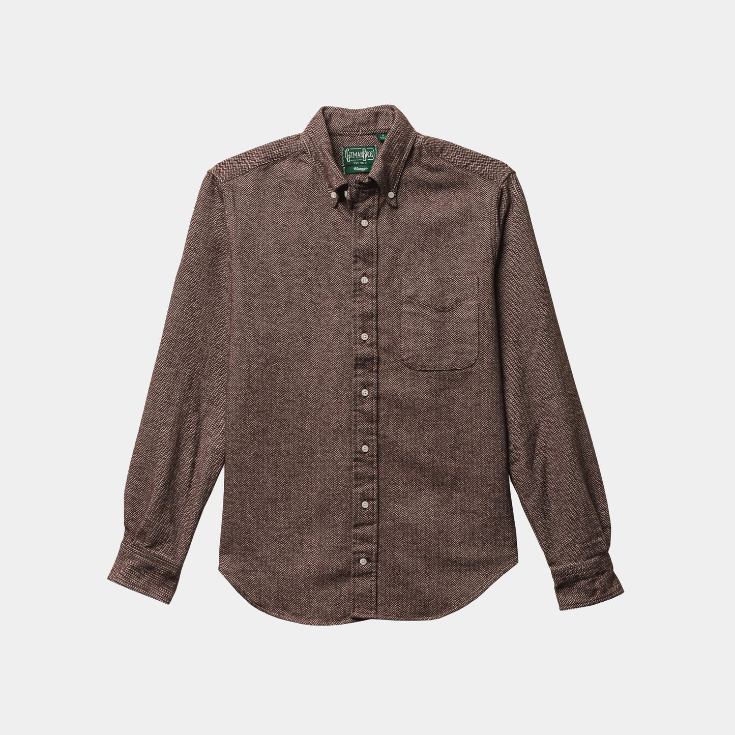 The Gitman Vintage Brown Herringbone Flannel is a brown, long-sleeve button-up shirt with a front chest pocket, displayed flat on a white background.