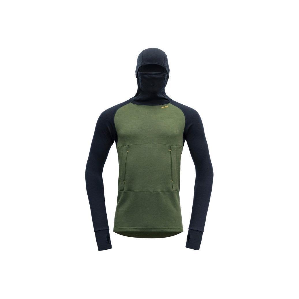 Introducing the Devold M Expedition Arctic Hoodie in Forest Ink: a green/black Merino wool long-sleeve top with a hood, face covering, thumb holes, and kangaroo pocket—ideal for outdoor adventures.