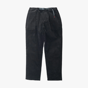 The Gramicci Corduroy Loose Tapered Ridge Pant features black stretch corduroy, an elastic waistband, and built-in belted closure, shown on a white background.