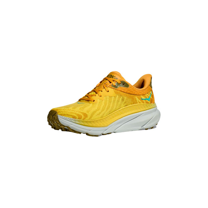 Introducing the Hoka M Challenger ATR 7 in Passionfruit/Golden Yellow: a running shoe with a textured pattern, green accents, and a white sole. Designed for enhanced all-terrain traction, it’s ready to meet every challenge on your path.