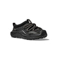 The Hoka U Ora Primo in black showcases a textured, insulated puff upper for easy slip-on comfort, complemented by thick twisted laces and a chunky sole, viewed from a slightly elevated angle.
