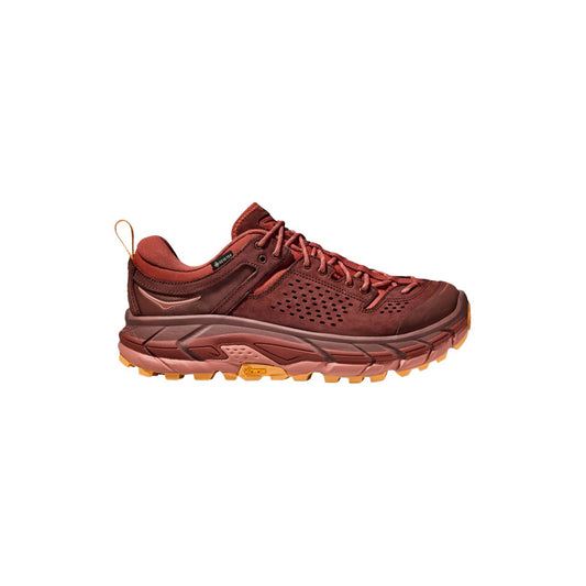 A single Hoka U Tor Ultra Lo trail shoe in Spice/Hot Sauce, featuring a rugged, textured sole and orange accents, viewed from the side.